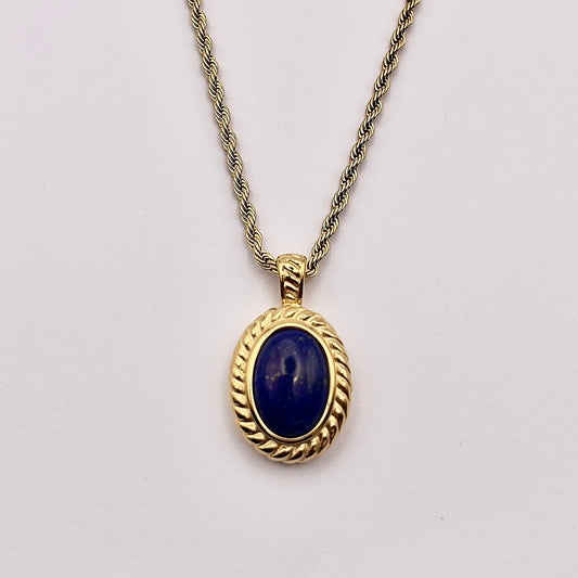 Front view of Rcti, an enchanting oval replica Lapis Lazuli set finished with a beautiful braided gold plated rope chain.