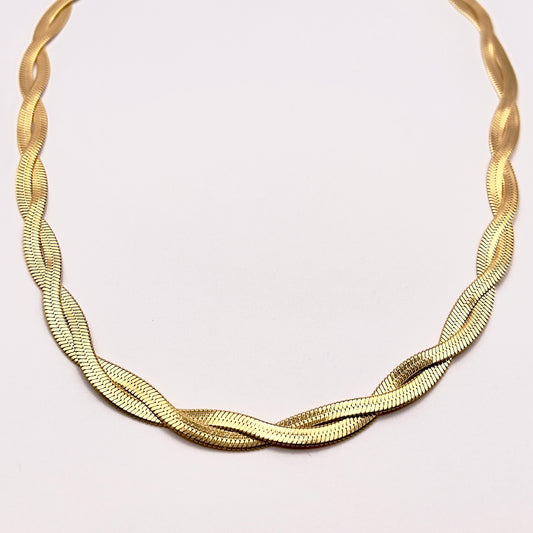 Close up view of Saro, an elegant and glamorous gold plated intertwining snake chain necklace choker