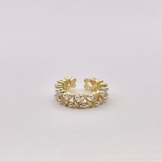 Front view of Tari, a capturing gold plated double layer pearl and zircon semi flexible ring.